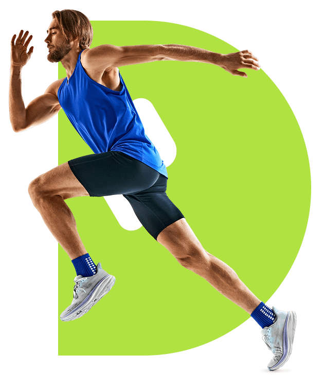 A man in blue athletic wear sprinting forward.