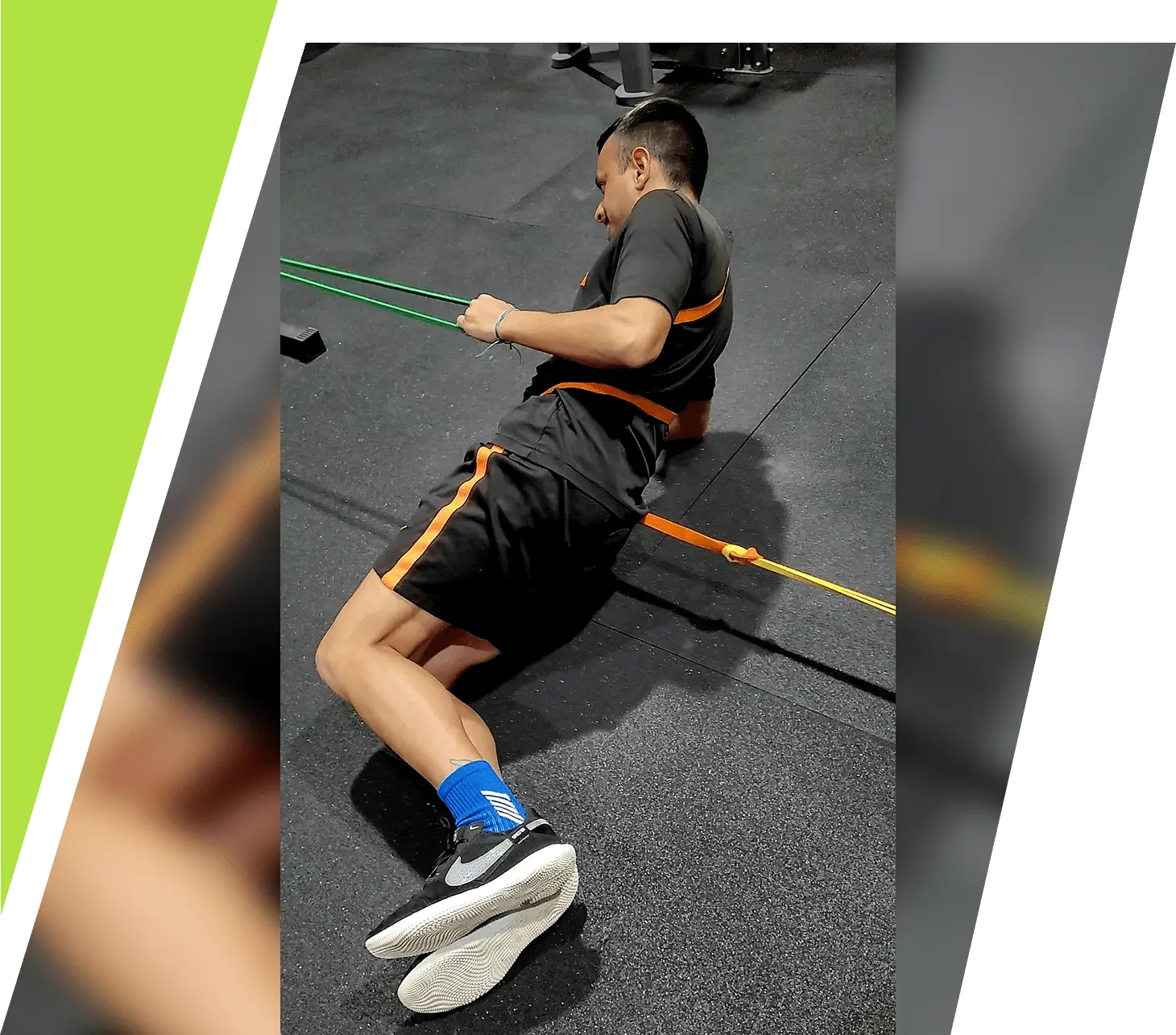 A man in sportswear jumping over an orange bar indoors.